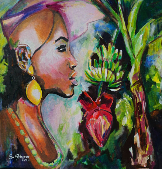 a woman with a banana tree with a bunch of green banana handing