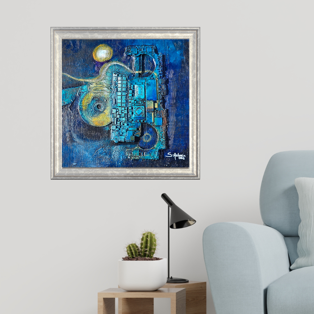 Abstract blue painting in a silver frame on a wall above a light blue armchair.