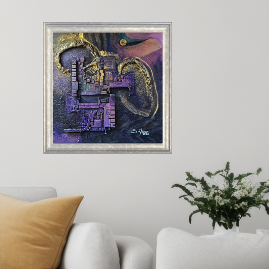 Abstract painting in a silver frame on a wall above a white sofa with a brown pillow and a plant.